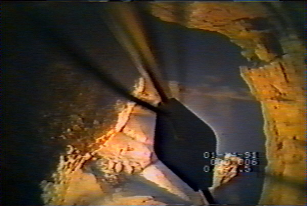 Video still showing detail of blasted rock debris