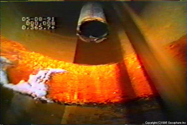 Video still showing casing leakage/corrosion